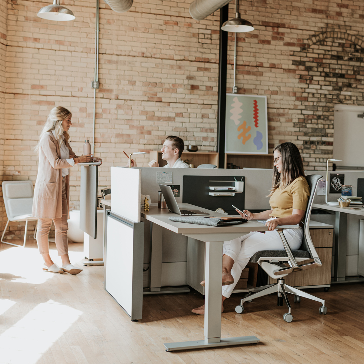 bring-haworth-home Group of people working at open cubicles
