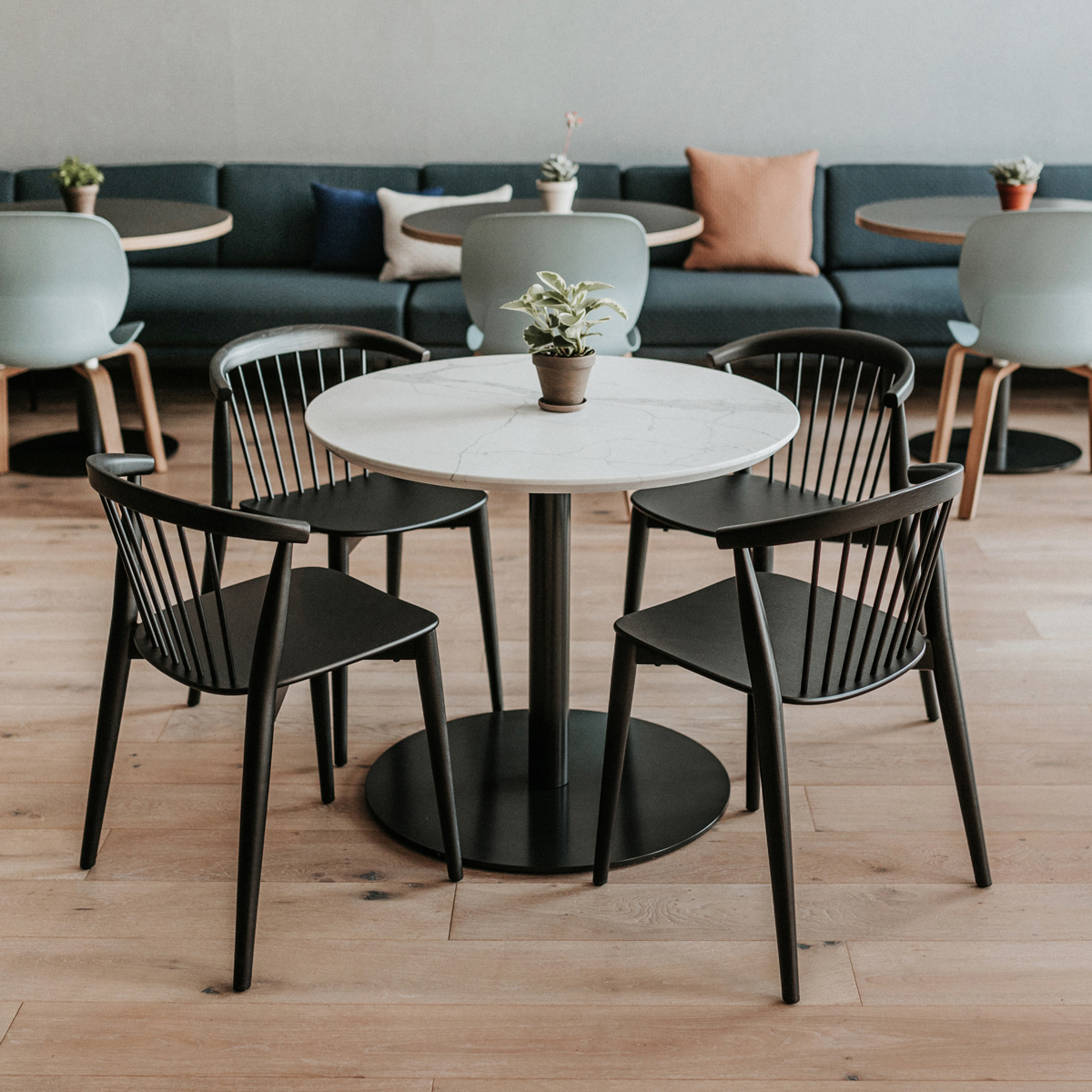 our-designs Four chairs surrounding a circular table