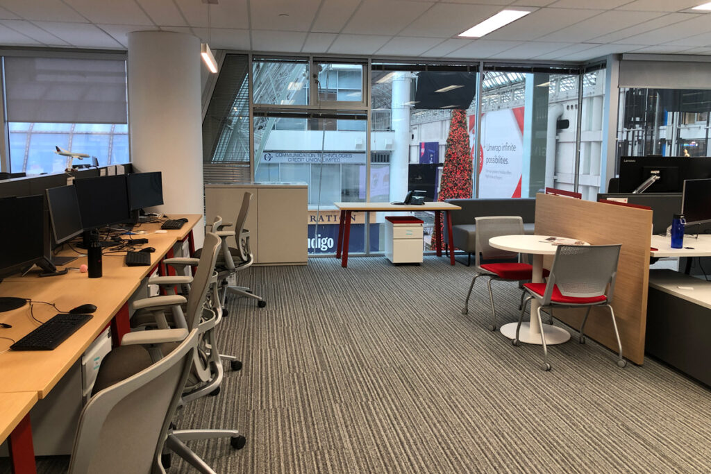 air-canada-image-3 Office chairs pushed in at tables with a big window in the background