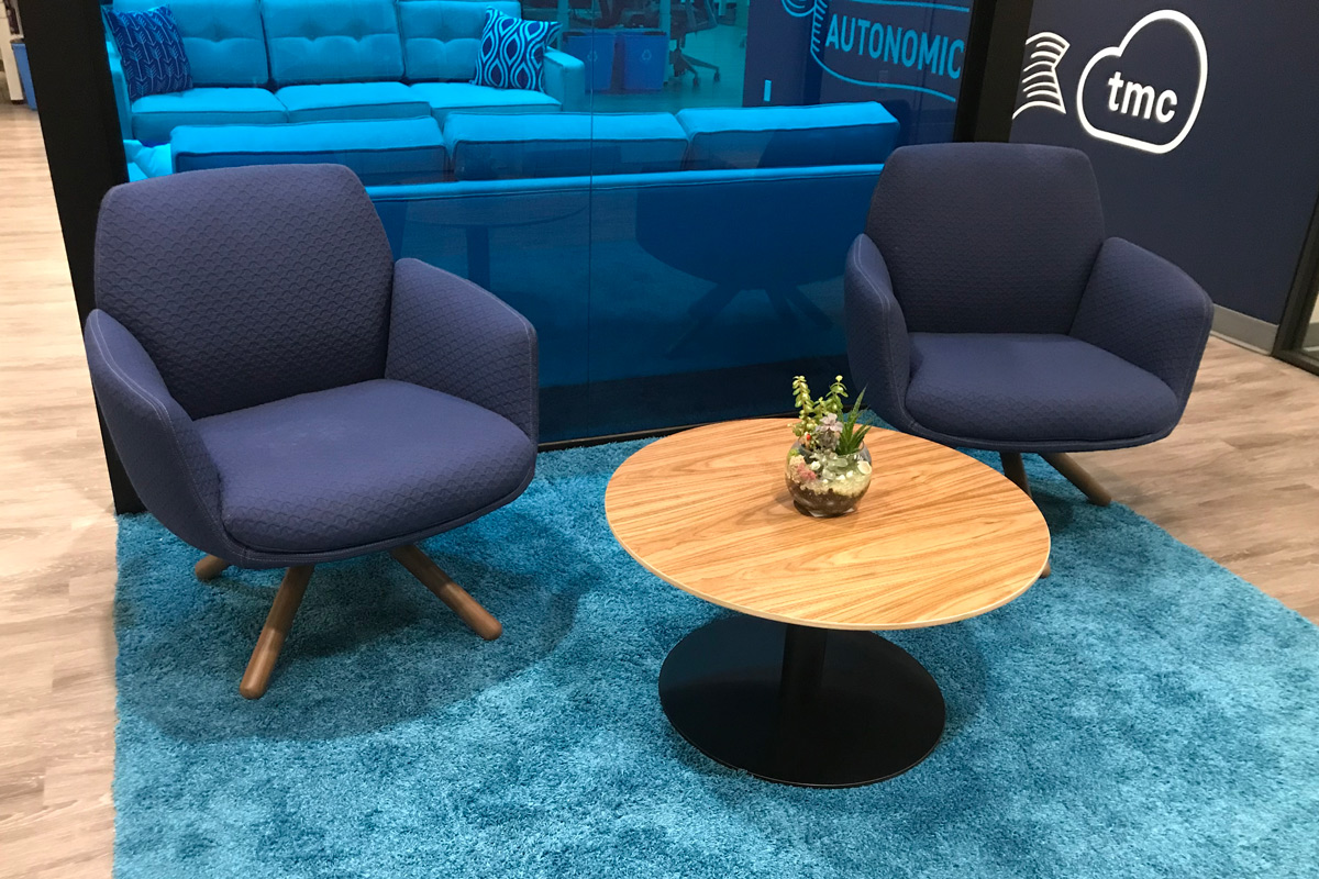 autonomic-card Two arm chairs behind a small circle table