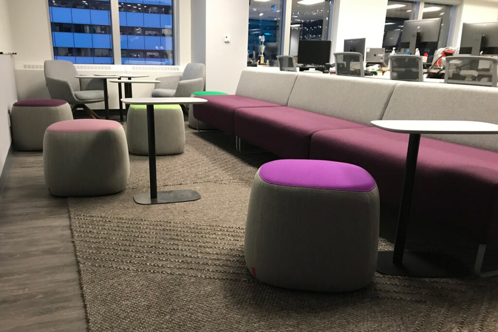 autonomic-image-1 Long couch bench with small tables and stools in front