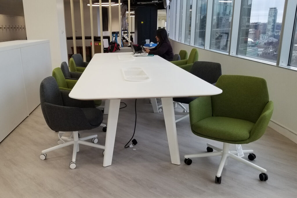 opg-image-1 A long desk with several office chairs