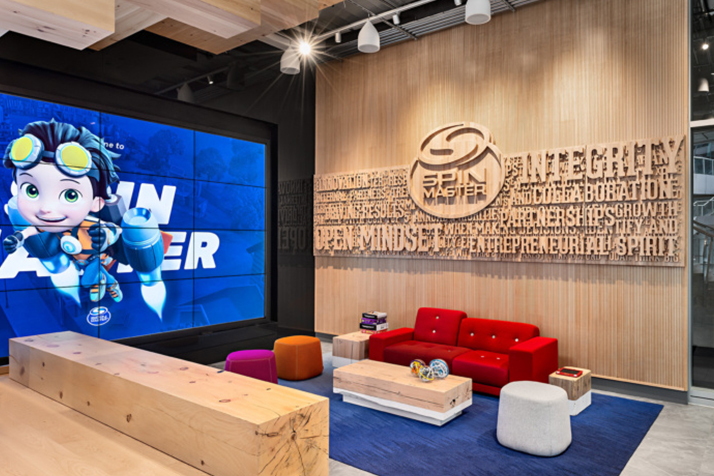 spin-master-image-1 Small couch seating area with a big accent wall and a TV wall