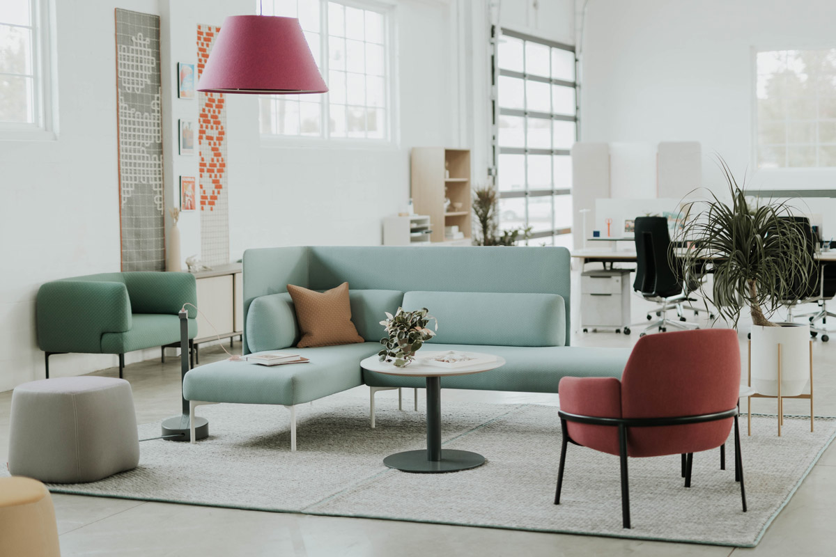 seating-card A sectional couch and an arm chair facing each other across a table